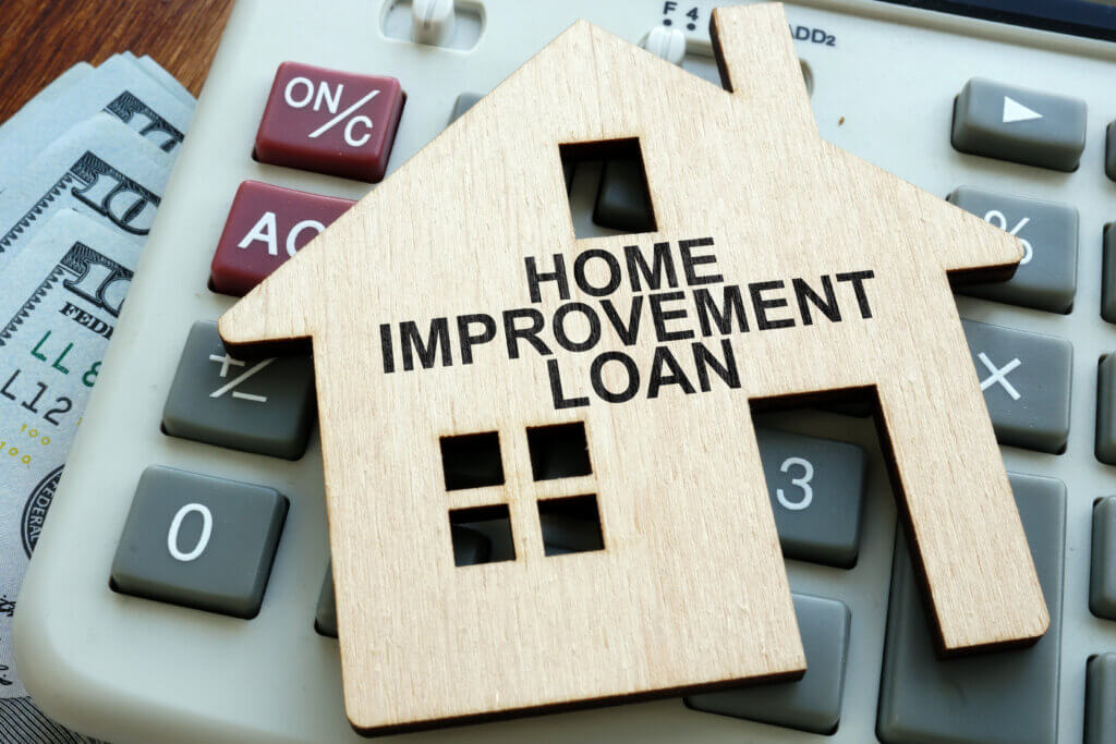 Home improvement loans written on the model of home.